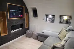 Severn sofa and smart TV with an electric fireplace
