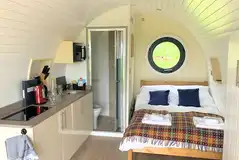 Three person (Chwefru and Irfon) interior with a double bed and sofa bed