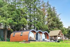 Eight person (Severn) pod with a patio and covered hot tub