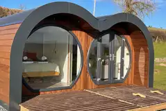 Usk (eight person) glamping pod with a double glass front
