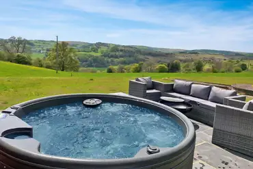 Chwefru and Irfon glamping pod outdoor area and hot tub