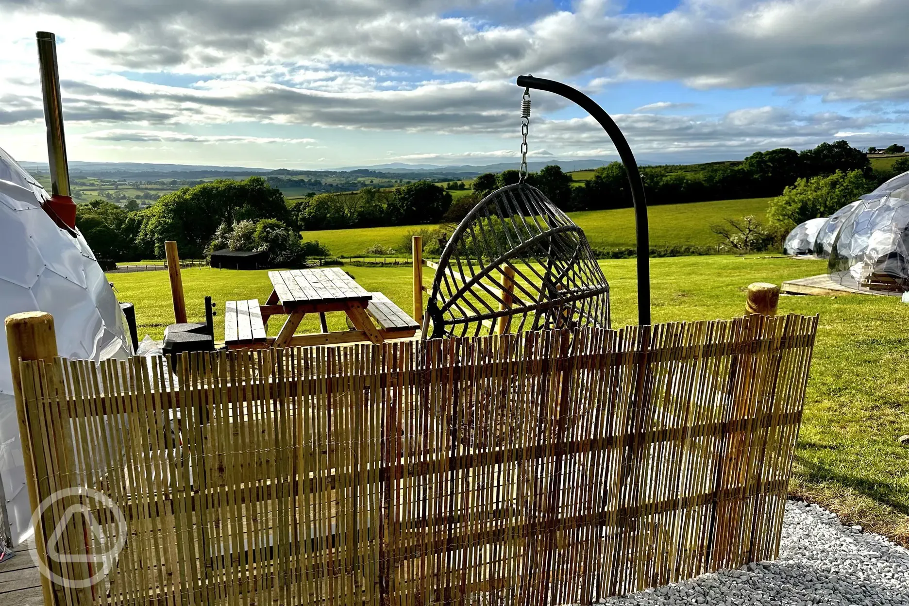 Countryside views from the outdoor seating area of the glamping domes