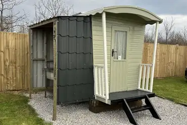 Shower cabin with an undercover washing station