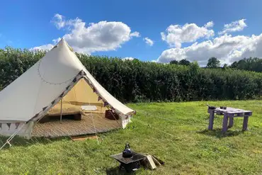 Bell tent with a fire pit