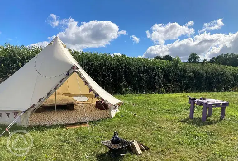 Bell tent with a fire pit at Menagwins Farm