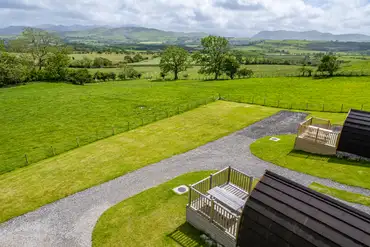 Glamping pods with decking areas and uninterrupted views