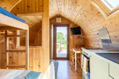 Five person pod with views to the dining area and TV
