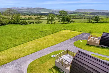 Glamping pods with decking areas and uninterrupted views
