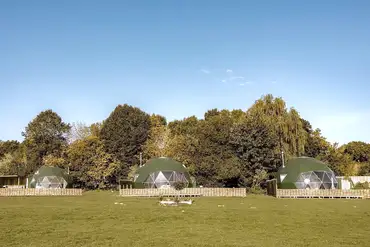 Glamping domes with private decking areas at Greenacres Campsite