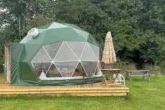 4m Star geodome on a decking with outdoor furniture