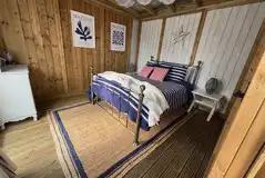 Ebb and Flow glamping cabin bedroom Ebb and Flow glamping cabin bedroom