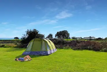 Large tent on grass pitch (10m x 10m) at Llwyn Griffri
