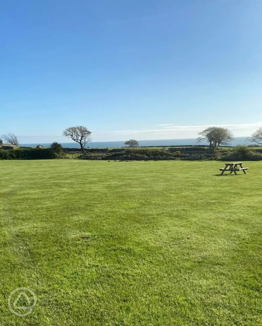 Non electric grass pitches with a picnic bench