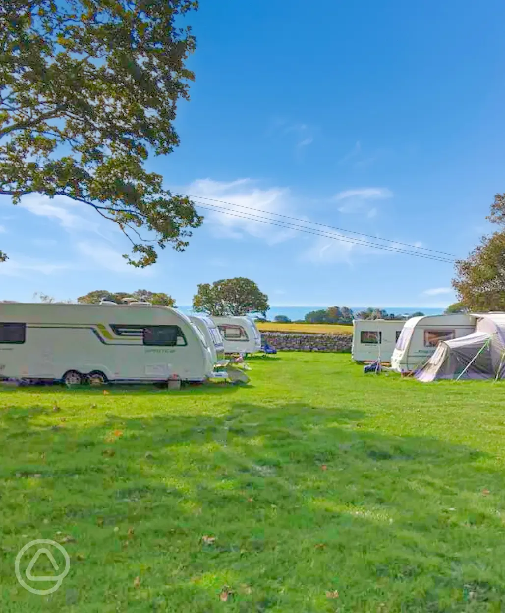 Caravans on the grass pitches at Llwyn Griffri