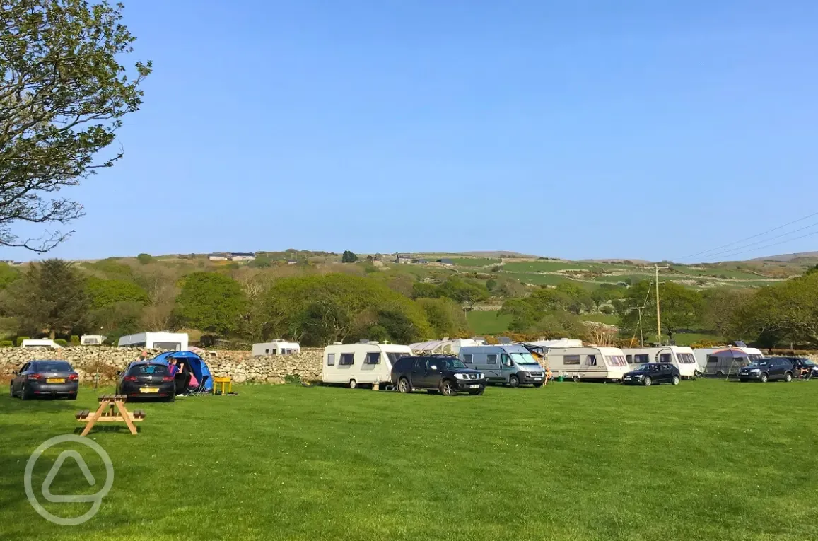 Grass pitches (10m x 10m) with space for one parked car