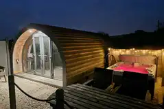 Squirrel glamping pod and hot tub at night Squirrel glamping pod and hot tub at night