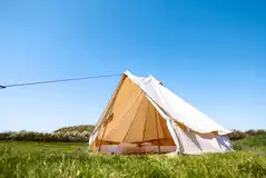 Bell tents with two single beds and bedding