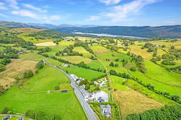 Aerial view of The Church House overlooking the Lake District and Coniston water