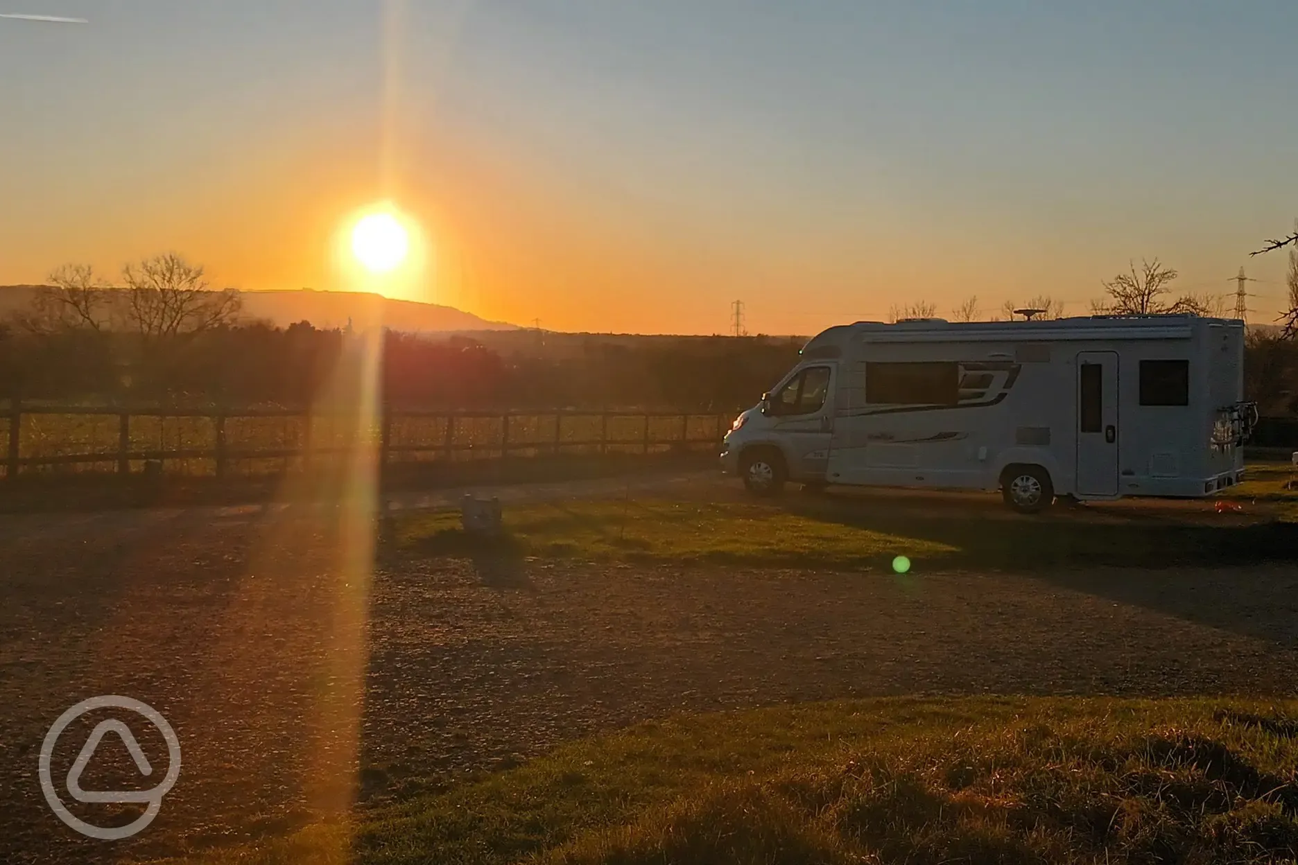 Electric hardstanding pitches at sunset