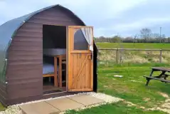 Log pod patio area with outdoor bench
