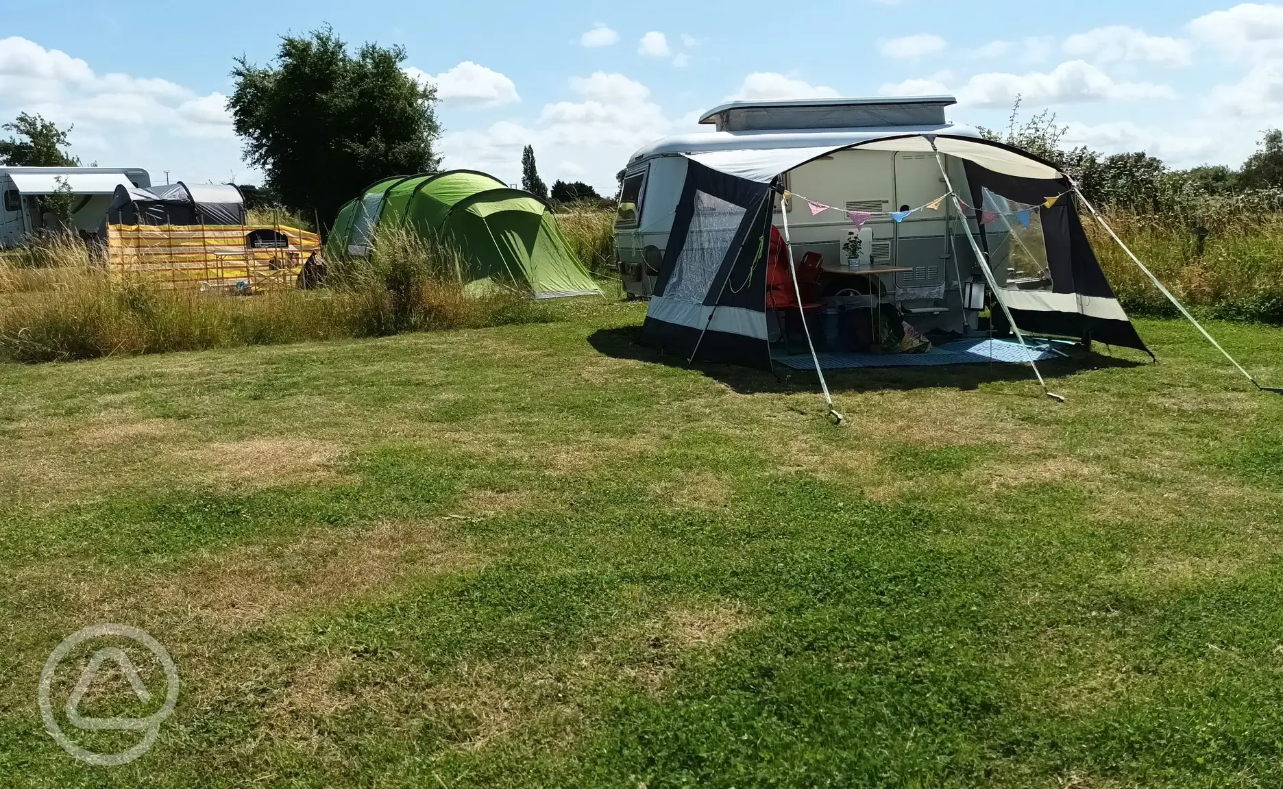 Grass pitches with a tent