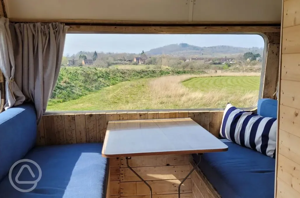 Vintage caravan dining area with views of Bredon Hill and the Malverns