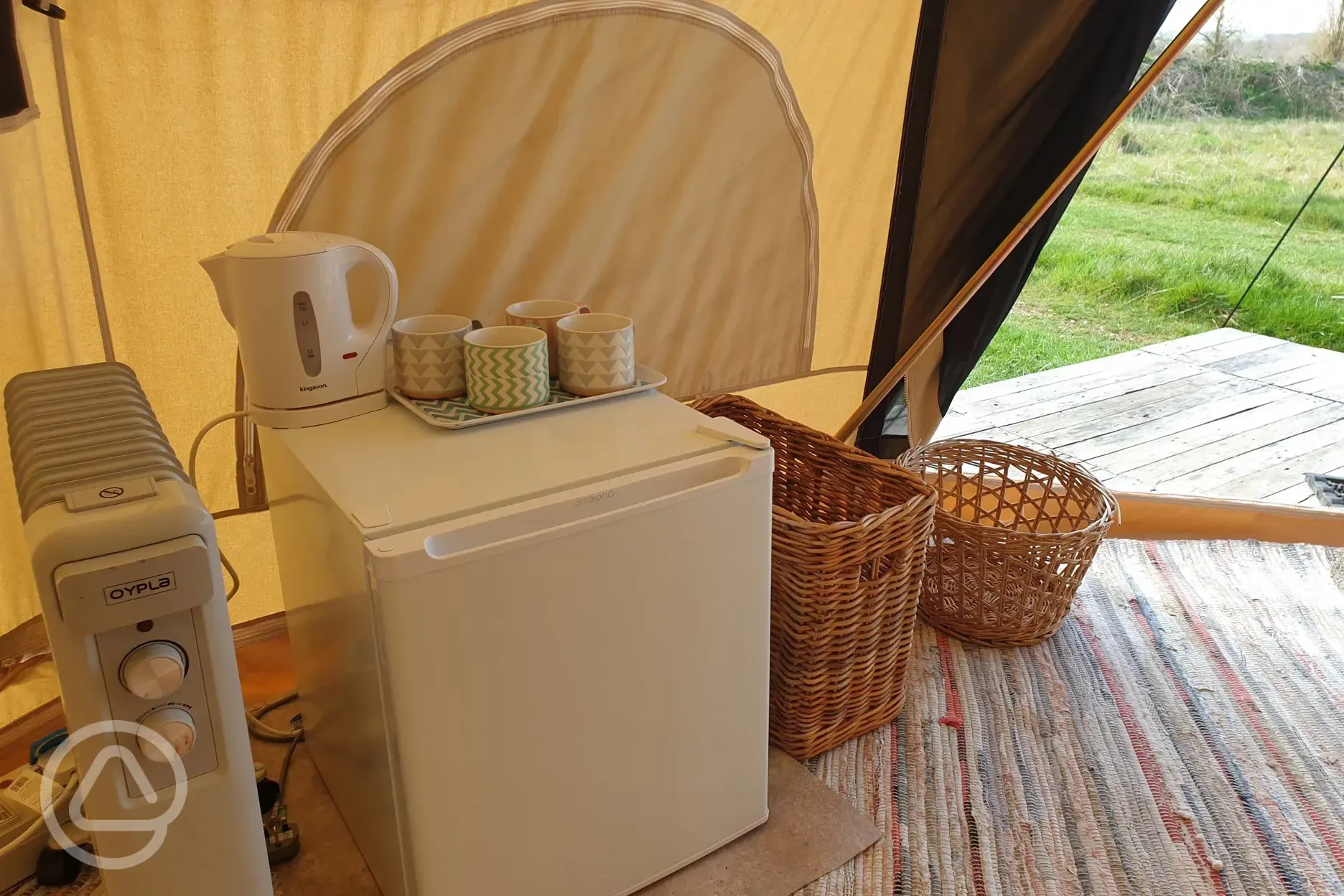 Bell tent fridge with kettle and mugs