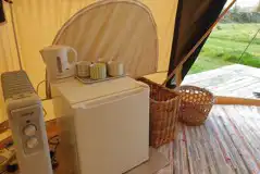 Bell tent fridge with kettle and mugs
