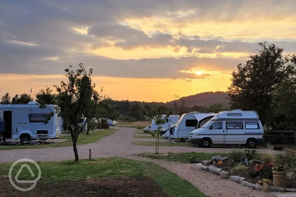 Electric hardstanding pitches at sunset