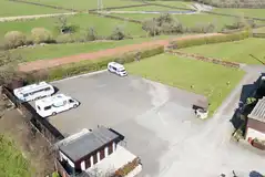 Aerial of the hardstanding pitches backed by hedges