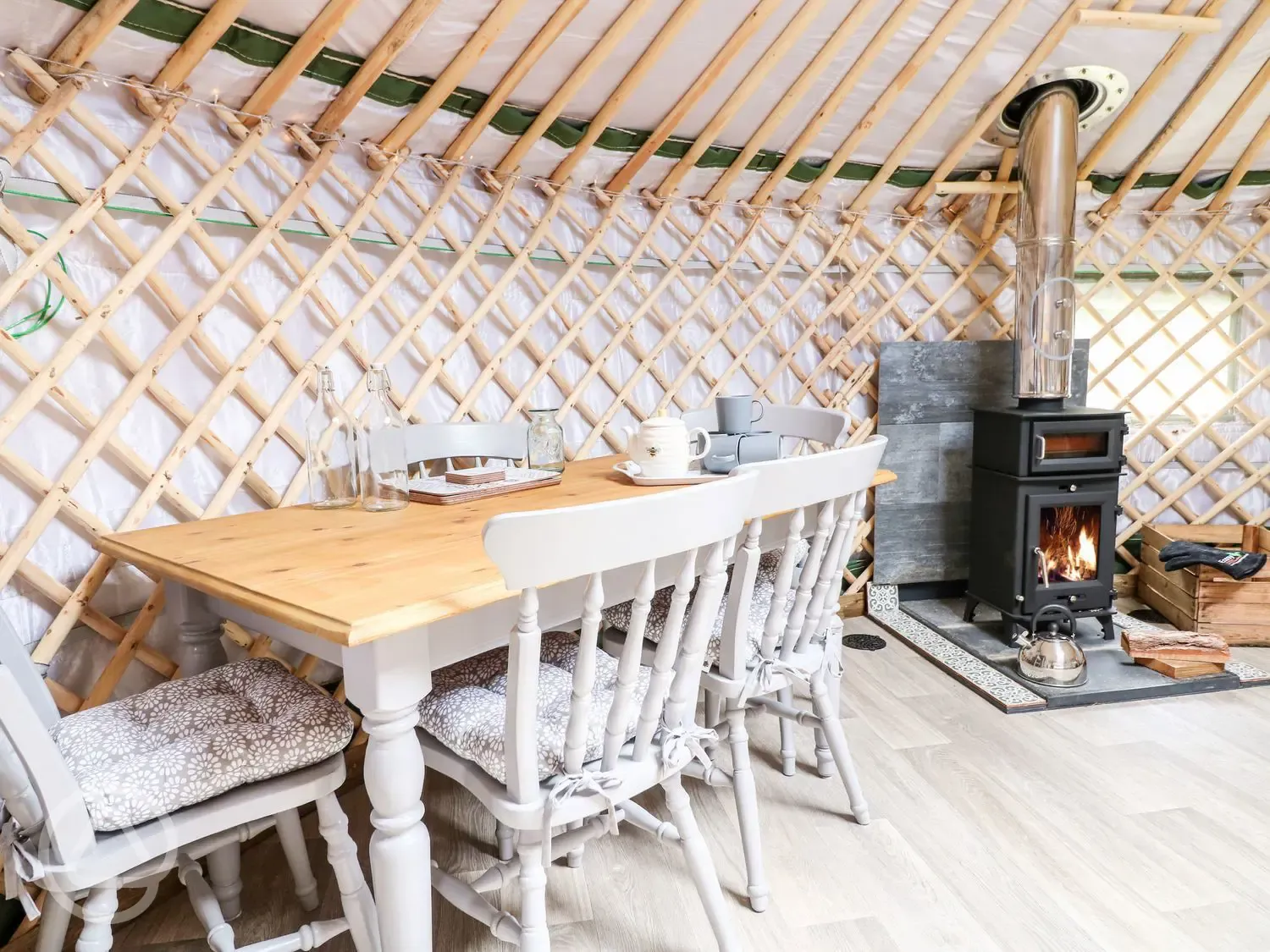 Silver Birch yurt with hot tub dining area and stove
