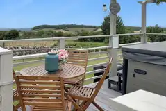 Yurts outdoor seating with private hot tubs with rural views