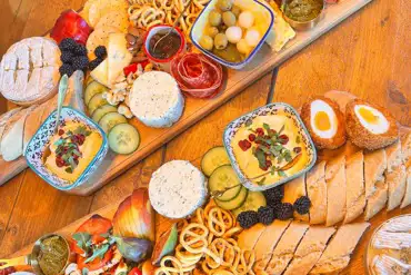 Charcuterie board hamper with bread, cheeses, meats, dips and more (extra cost)