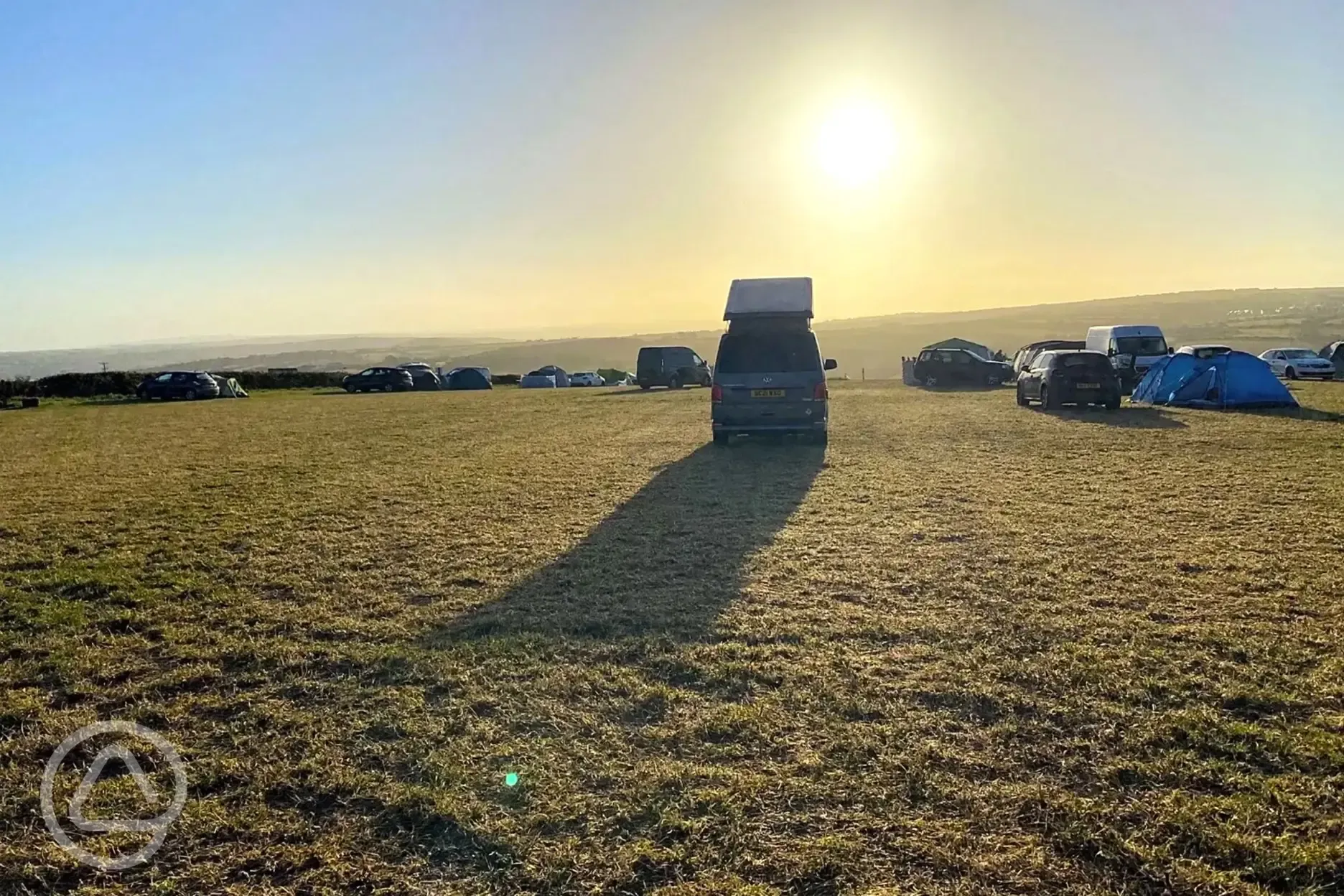 Non electric grass tent pitches at sunrise