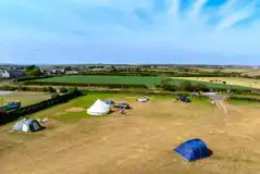 Aerial of the non electric grass pitches and entrance gate Aerial of the non electric grass pitches and entrance gate