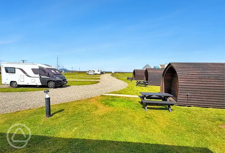 Electric hardstanding pitches beside the pods at Harbour Side Caravan Site
