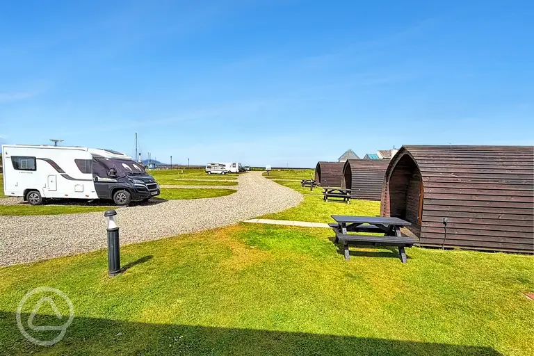 Electric hardstanding pitches beside the pods at Harbour Side Caravan Site