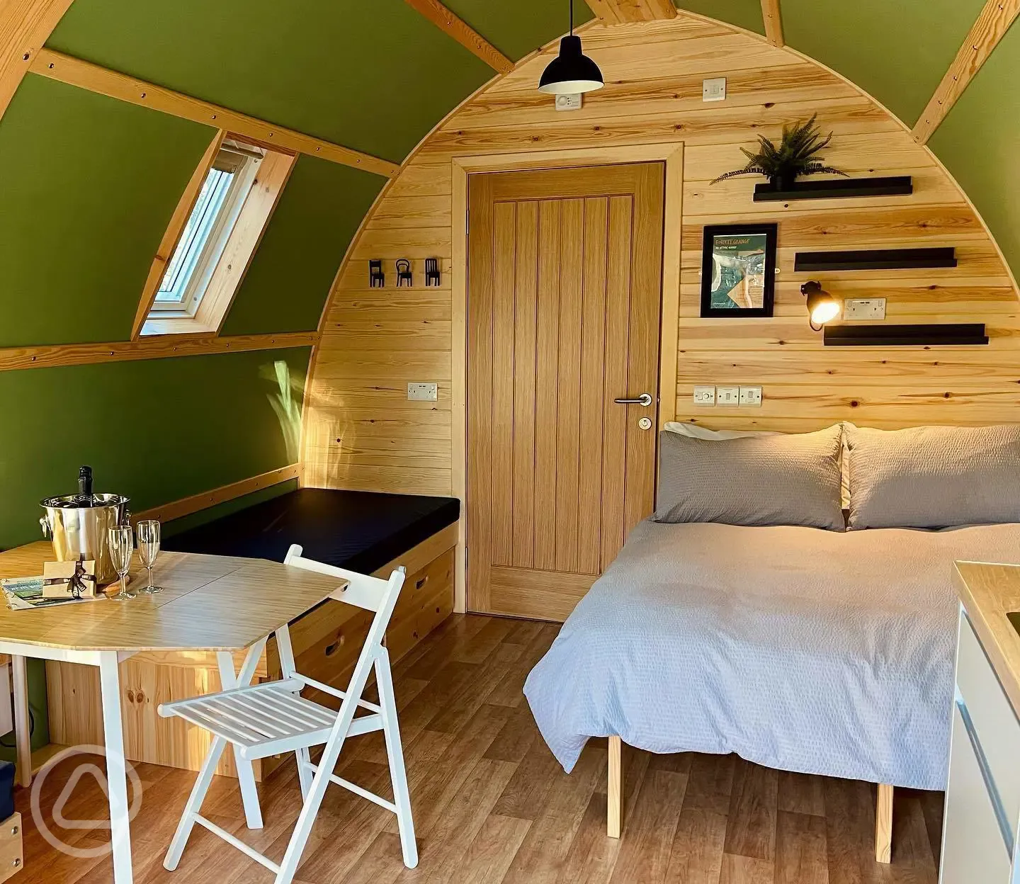 Foxwood pod interior with double bed and seating area