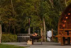 Quarry pods with hot tubs surrounded by woodland