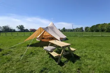 Bell tent with picnic bench