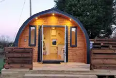 The Roost glamping pod exterior with private decking and hot tub
