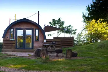 The Den glamping pod with patio, deck area and covered hot tub