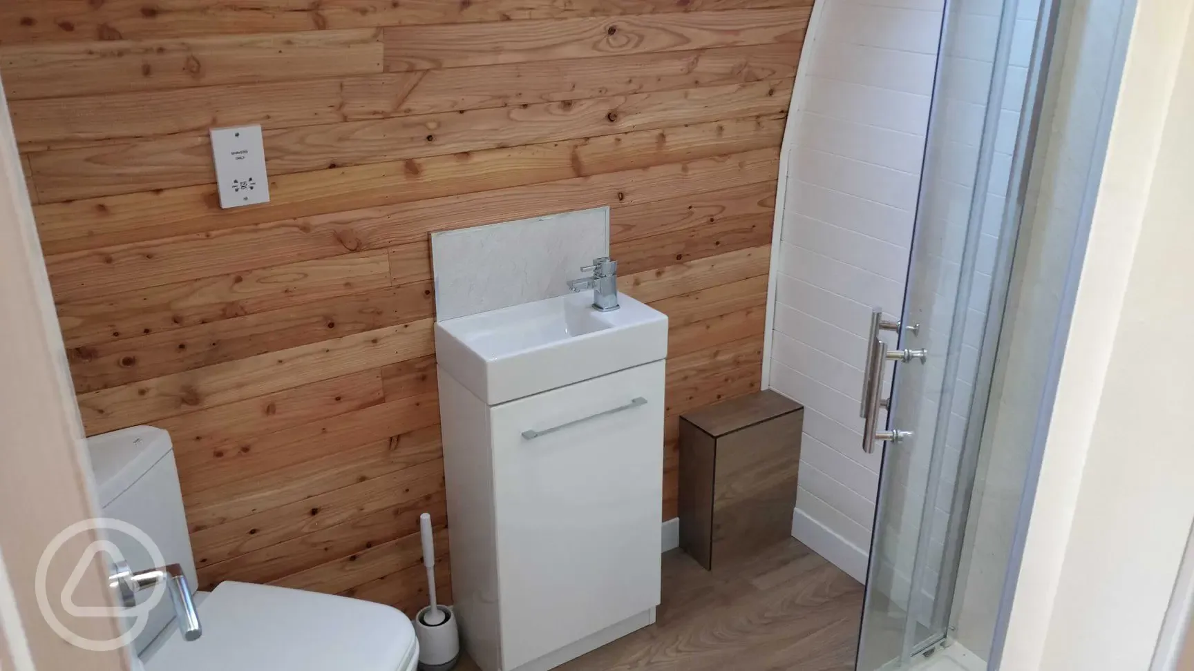 The Den and Roost glamping pod ensuite with shower, toilet and sink