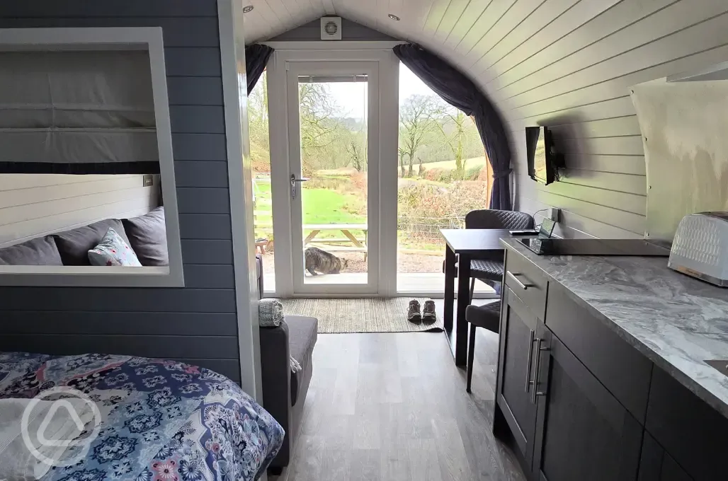 The Nest glamping pod interior with countryside views