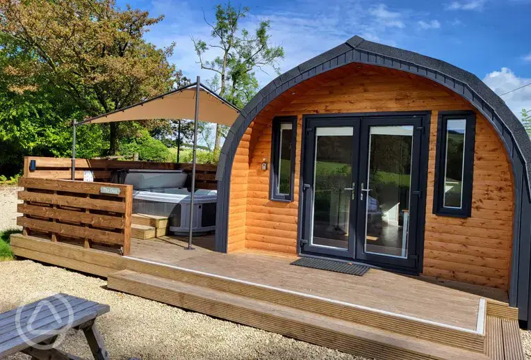 Glamping pod exterior with hot tub