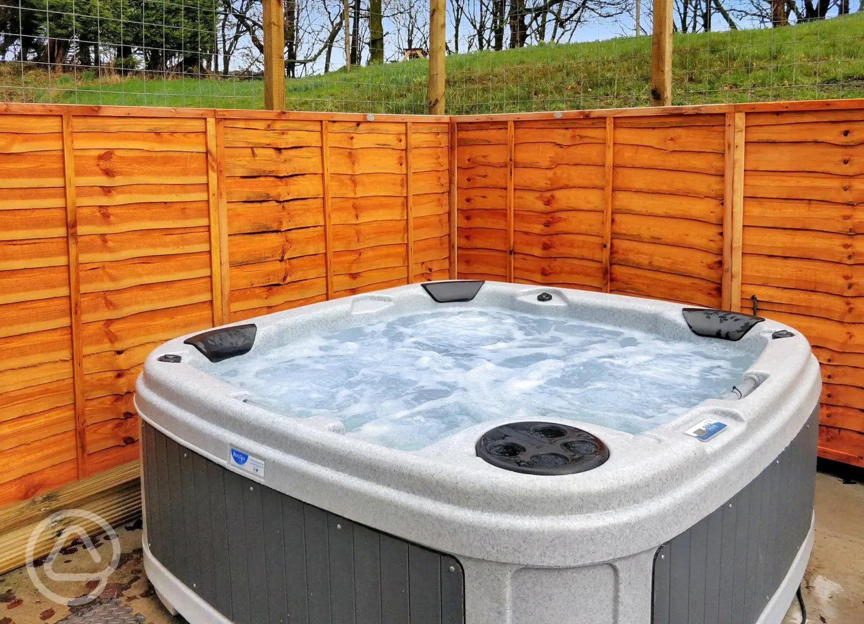 Private hot tub on the decking area next to the pods at Auchenhean Pods