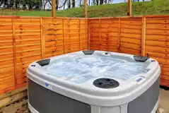 Private hot tub on the decking area next to the pods at Auchenhean Pods