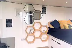 Bumble shepherd's hut interior with soft furnishings and shelves