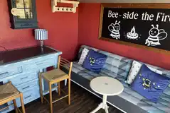 Bumble shepherd's hut kitchen with a sofa Bumble shepherd's hut kitchen with a sofa