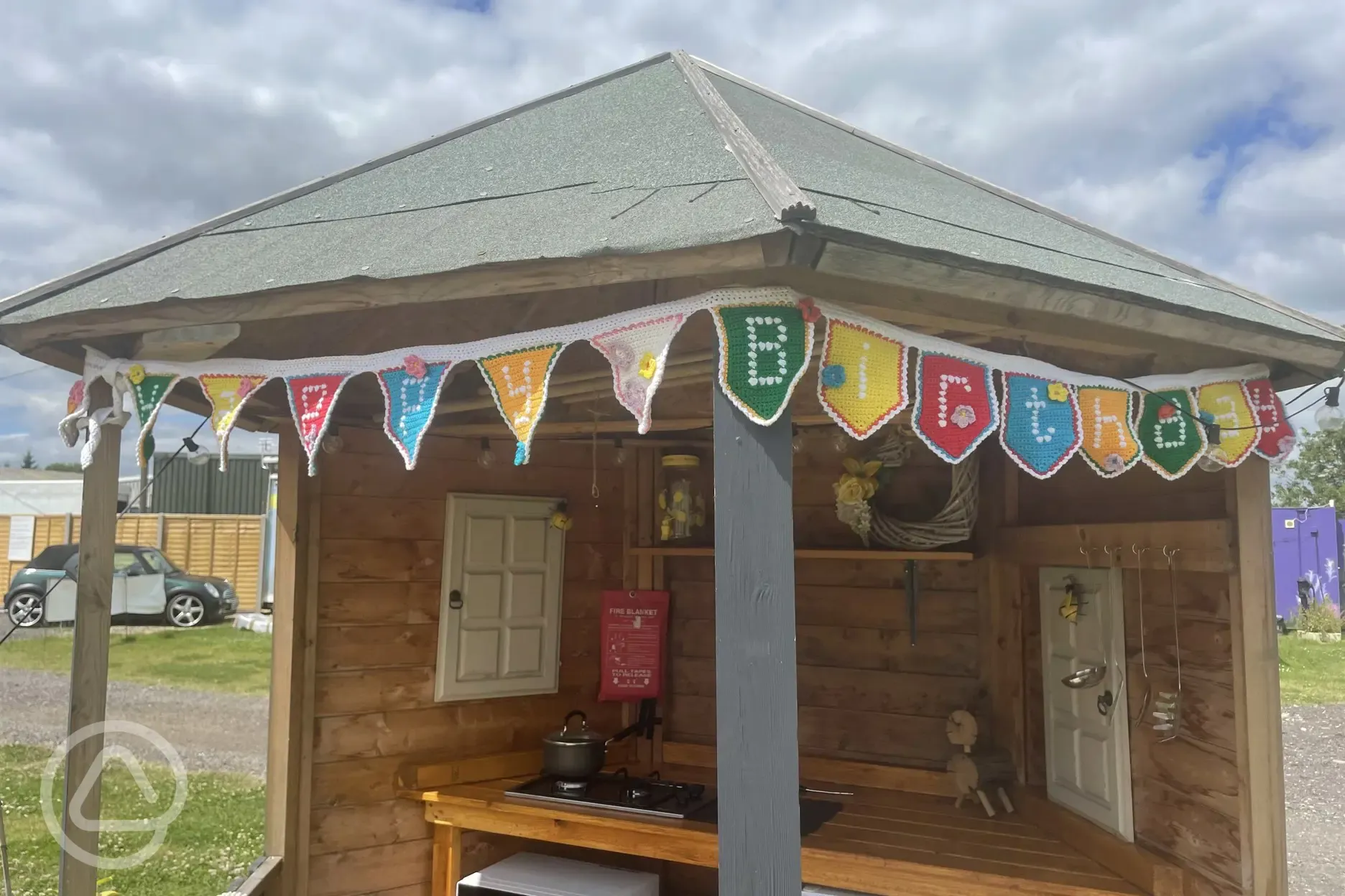 Bumble shepherd's hut outside covered kitchen area